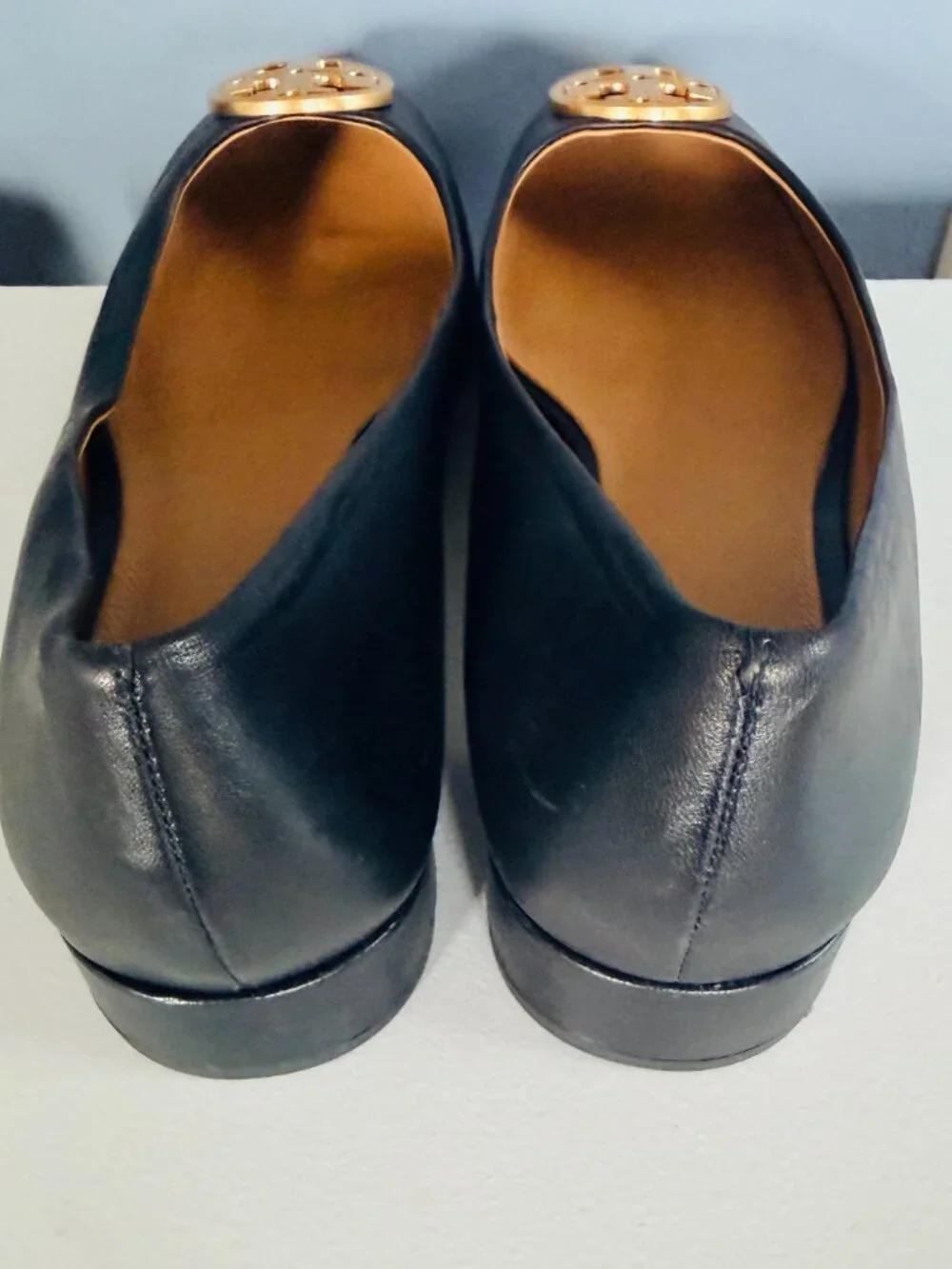 Tory Burch black leather flats. Gold-tone metal logo plaque on the vamp, Size 11